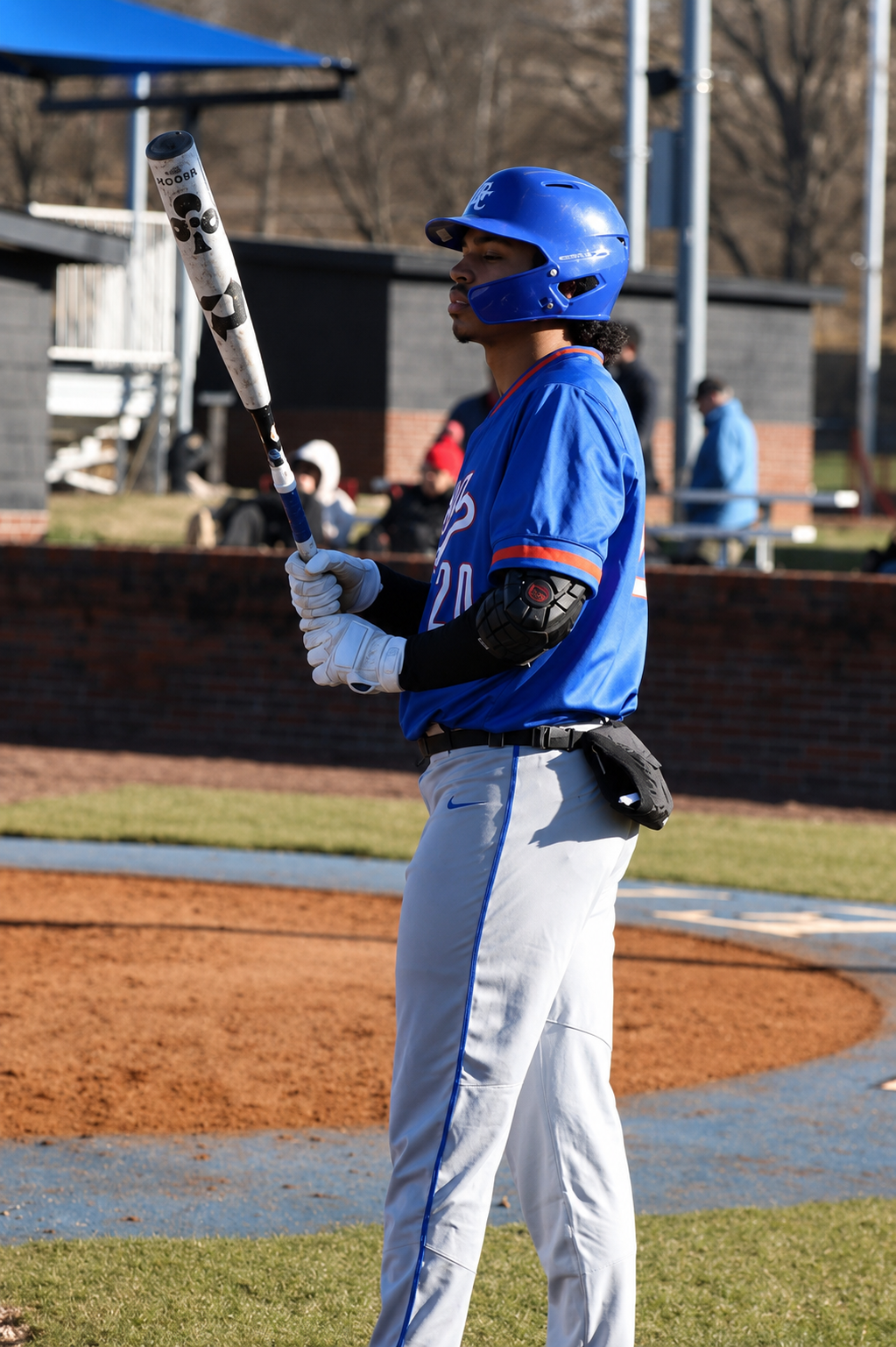 A focused baseball player at the plate, calm and ready.